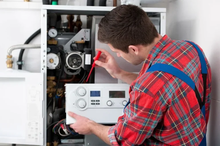 plumber in kansas city missouri repairing a water heater